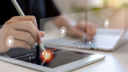 Women search for video content on internet, to watch online entertainment streaming, watch online streaming video. online learning, watch video and live, listen to music, shows or online lessons.