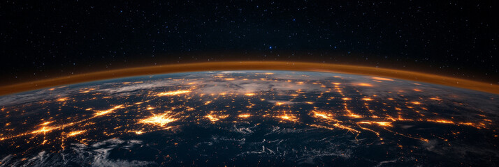 Earth at night with twinkling city lights.