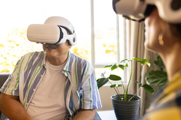 Using VR headsets, family members enjoying virtual reality experience together