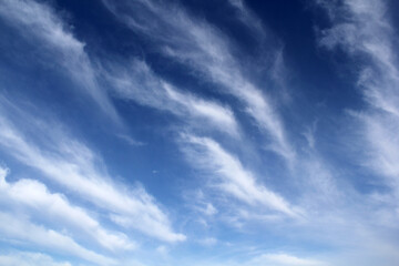 Blue sky with wispy cirrus clouds abstract background