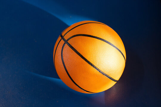Basketball on court, ready for game or practice, sports equipment close-up, copy space