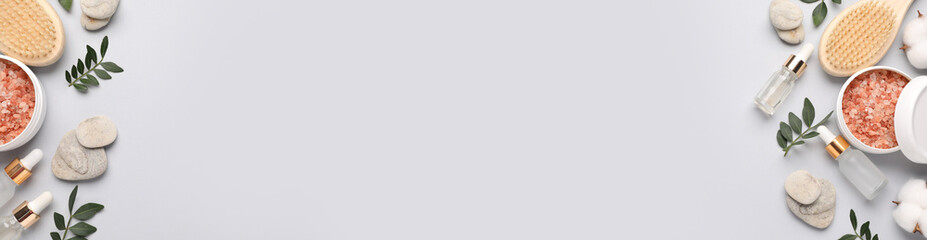 Cosmetic products on light background, flat lay. Banner design with space for text