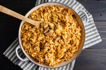 Beef Stroganoff in an Enameled Cast-Iron Pan : Cube steak and egg noodles in mushroom-sour cream sauce cooked in a large cast-iron braising pan