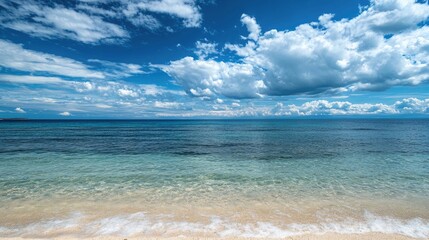 A peaceful day by the sea with crystal-clear waters, white sandy beaches, and a bright blue sky overhead.