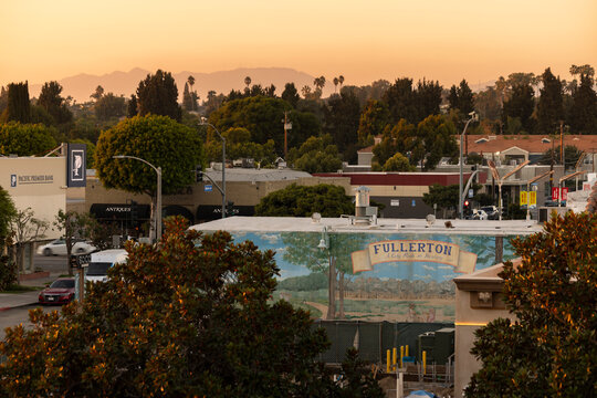 Fullerton, California, USA - September 28, 2024: Sunset light bathes historic downtown Fullerton in a warm glow.