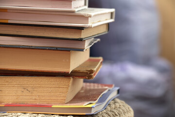 Stack of various books symbolizing knowledge, education, and wisdom