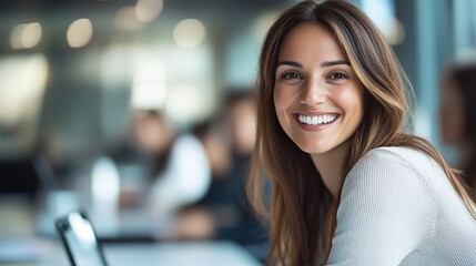 Obraz premium Smiling Woman in Bright Office Environment