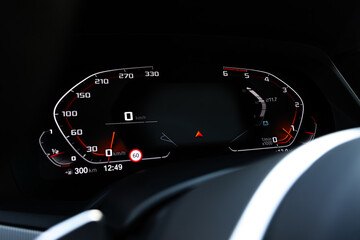 Close-up shot of a car's digital speedometer.Modern light car mileage (dashboard, milage). New...