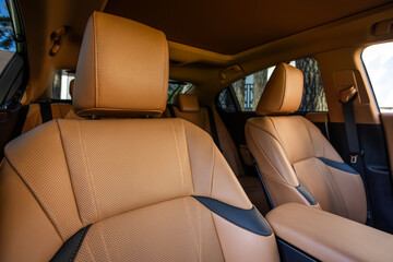 Close-up   beige  headrest driver's seat made of genuine leather