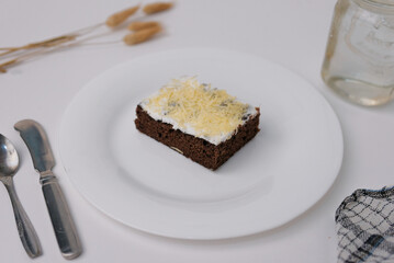 chocolate brownie cake with cream and cheese topping