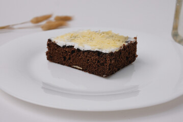 chocolate brownie cake with cream and cheese topping