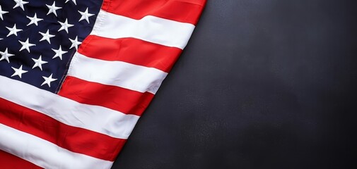 Obraz premium American flag draped on dark background, symbolizing patriotism and freedom.