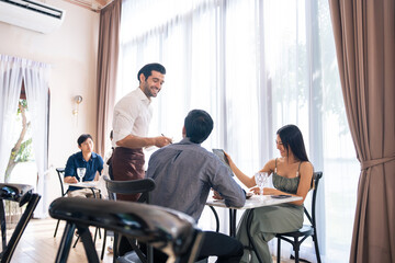 Asian young lovely couple customer having dinner in restaurant together