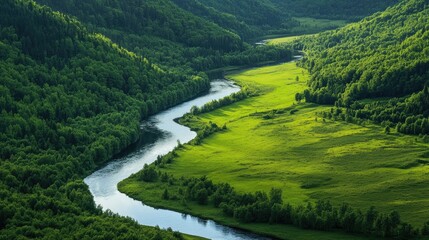 Peaceful river winding through a valley surrounded by rolling green hills and forests.