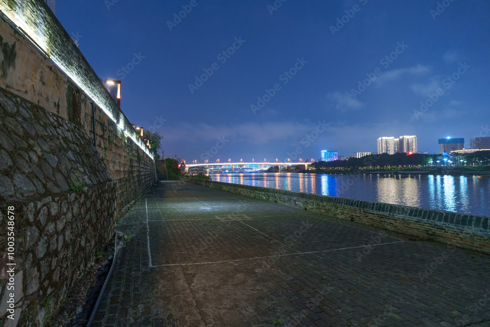 Wall mural Night view of traditional Chinese ancient city wall buildings