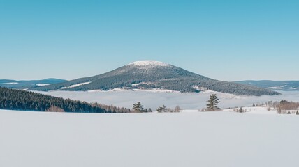 Obraz premium Serene Snowy Mountain Above the Clouds at Summit