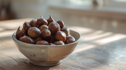 Obraz premium Rustic ceramic bowl filled with hazelnuts placed on a wooden table in soft natural light