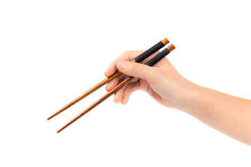 female hand using wooden chopsticks on white background	