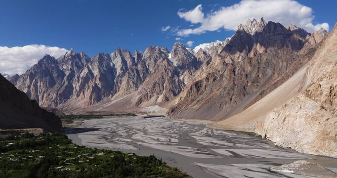Aerial Shot Above Hunza River, Passu Cones Mountains in Background. Pakistan. Beautiful Drone Shot