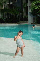 Girl playing in the pool