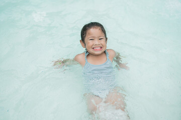 Girl playing in the pool