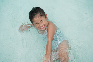 Girl playing in the pool