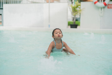 Girl playing in the pool