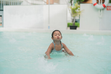 Girl playing in the pool
