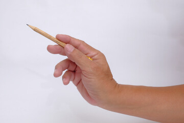 Someone pointing at something using pencil in the hand