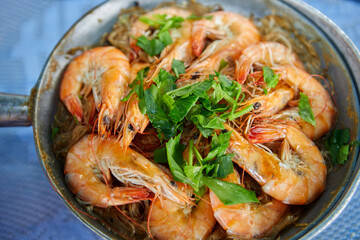Close-up view of steamed shrimp potted with vermicelli