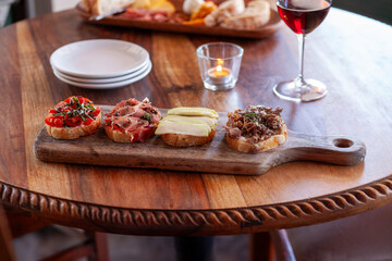 Bruschetta board on wood table in restaurant