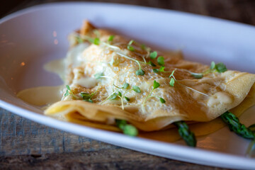 A savory crepe stuffed with asparagus