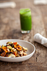 Close up of a rustic dish of charred vegetable goulash