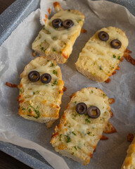 Halloween Garlic Bread Mummies - Delicious Close-Up