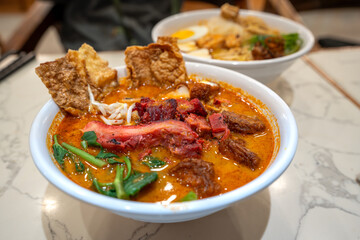 Popular Malaysia curry noodle - Curry Mee with fired tufu
