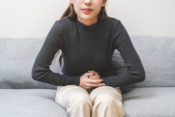 Flatulence ulcer, asian young woman, girl hands in belly, stomach pain from food poisoning,...