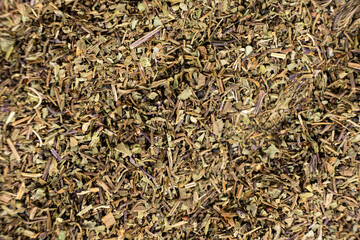 Dry basil spice seasoning macro texture top view