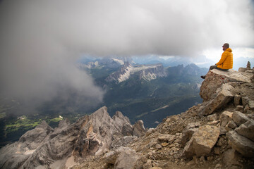Hiker enjoys the view from Tofana di Mezzo in the italian Dolomites.