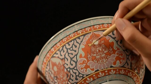 Thai Benjarong porcelain before glazing it and make a final firing. The patterns design of Thai Benjarong porcelain normally use traitional Thai style pattern or patterns from the Ramayana.