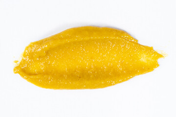 Smear of mustard sauce on white background isolate, creativity in cooking, macro texture