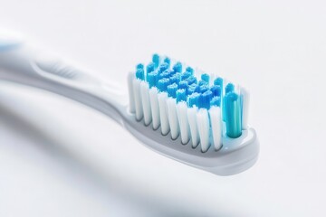 Toothbrush with blue bristles, white isolate background