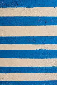 Detail of a white and blue exterior wall - background wallpaper
