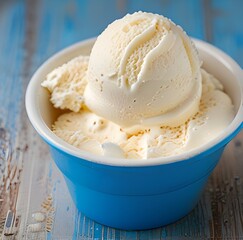 Vanilla ice cream scooped out of container