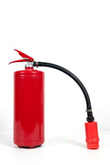 Fototapeta premium A red fire extinguisher with black hose on white background