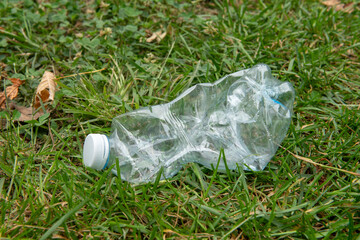 plastic waste in a meadow, plastic pollution is reaching intolerable levels, too many pollutants...