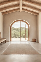 Minimalist interior design featuring a curved window and natural light in a serene countryside setting