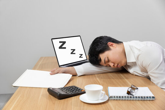 Man with narcolepsy is fall asleep on office desk..Narcolepsy is a sleep disorder that makes people very drowsy during the day.