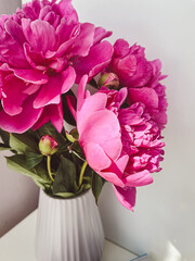 peonies in vase