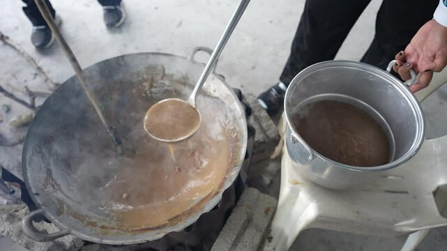person preparing dodol