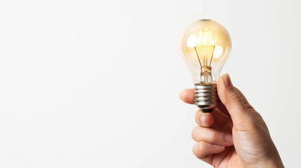 human hand holding a light bulb Creative ideas business ideas Innovative Startup Brainstorming isolated white background